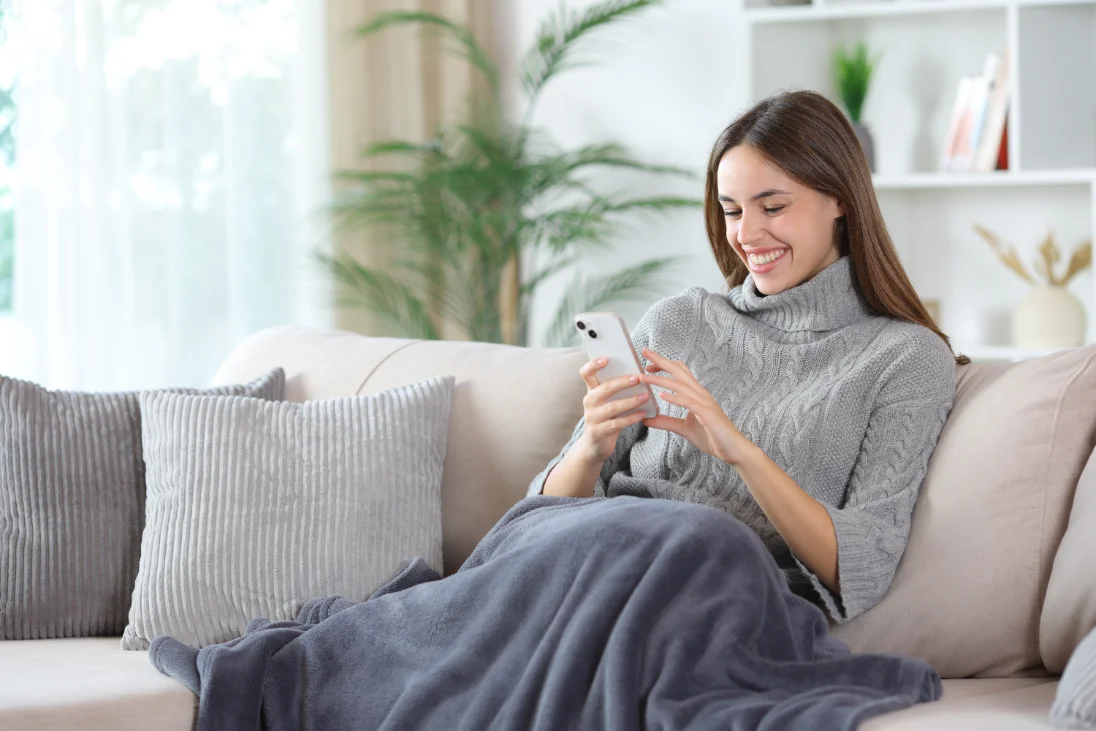 A patient meeting her physician online from home